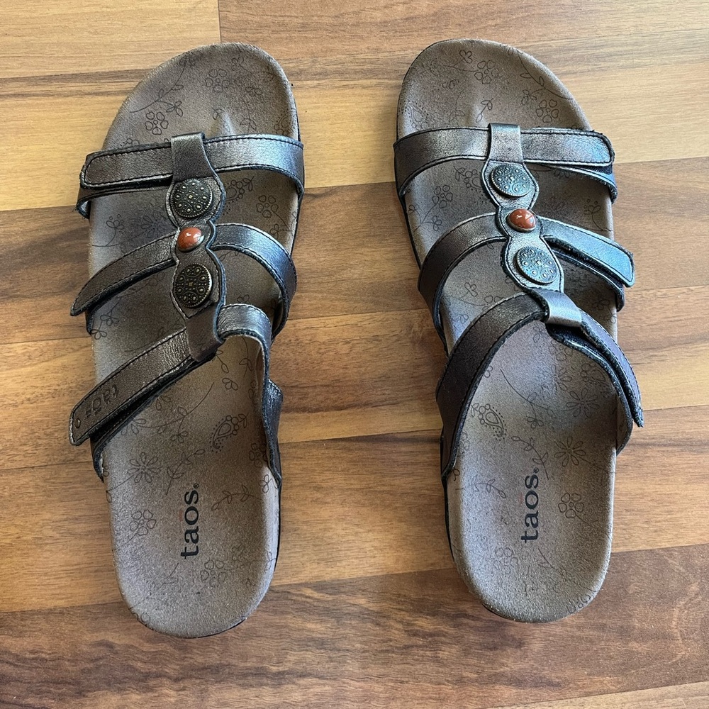 Taos Footwear Style:Prize Color: Pewter Sandals with Adjustable Straps.